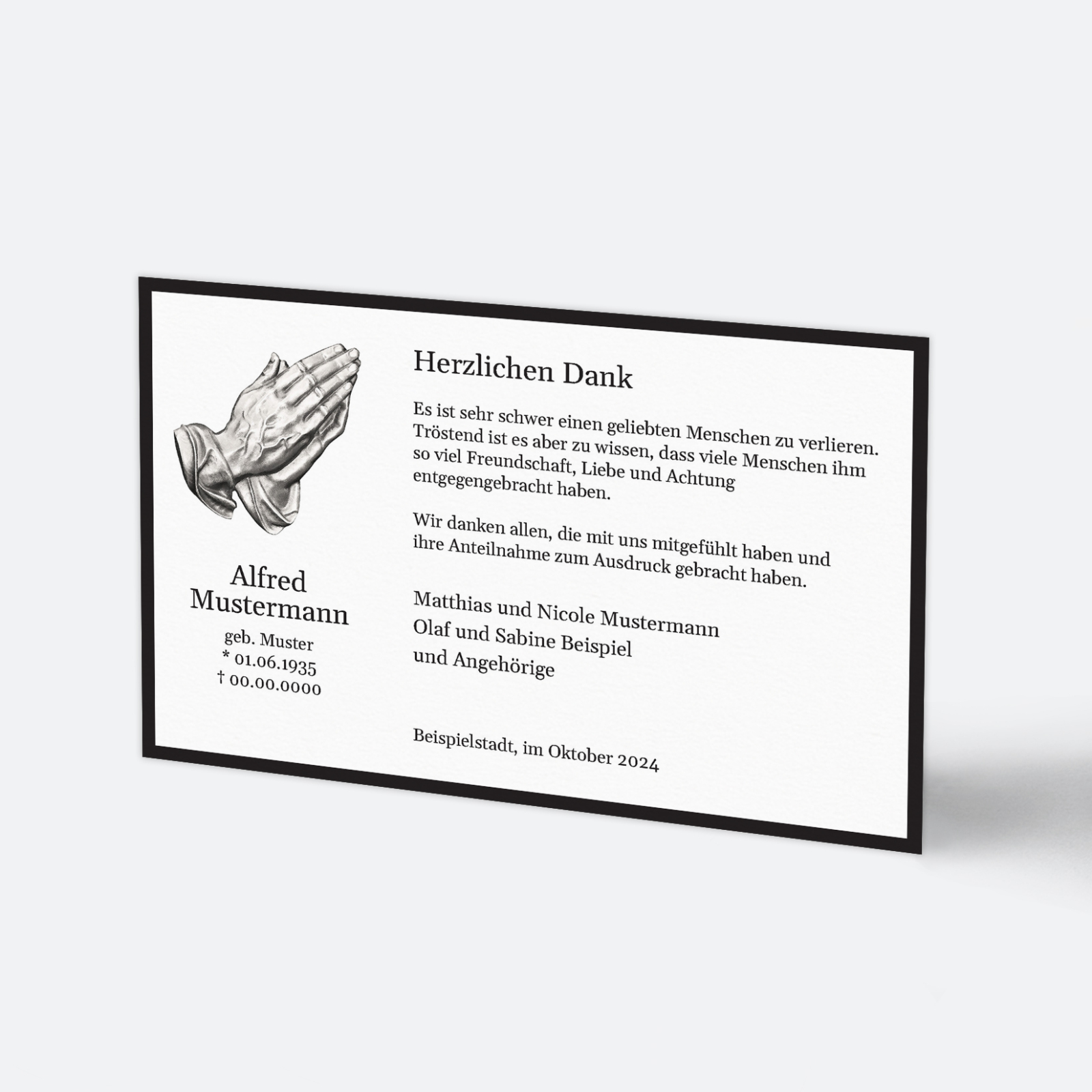 Klassische Trauer-Dankeskarte mit schwarzem Trauerrand und betenden Händen als Symbol.
